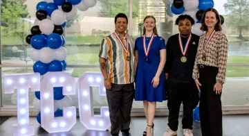 Four PVSA recipients pose for a photo