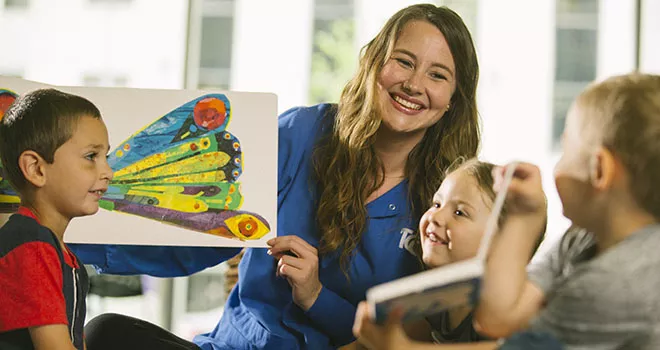 woman reading to children