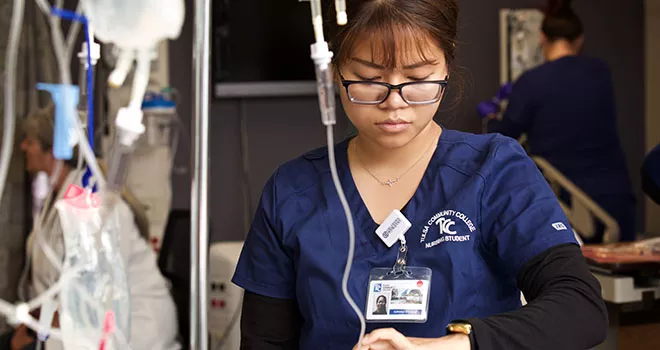 nursing student looking at wristwatch