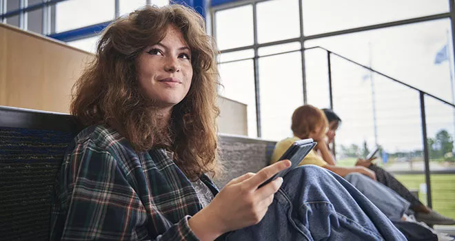 girl smiling sitting down