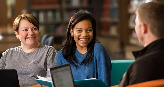 TCC a group of students studying at the Northeast Campus Library