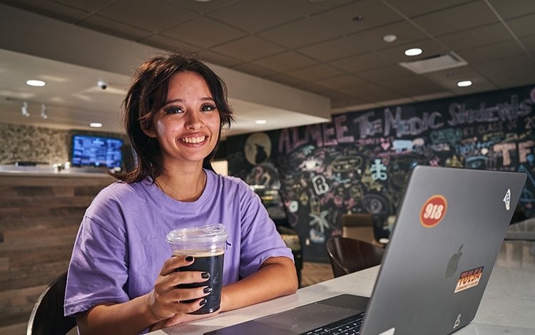 TCC student enjoys an iced coffee at The Perk on Metro Campus.